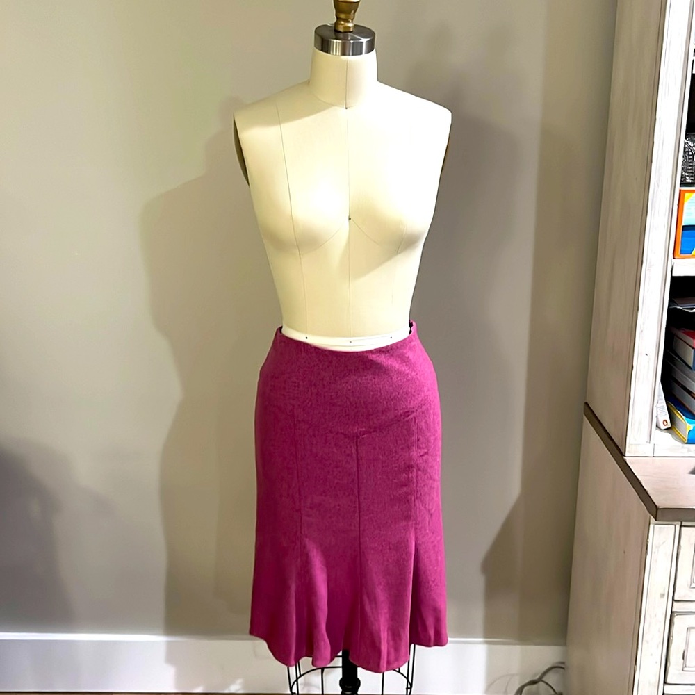 DVF fuschia pink skirt flairs in back.